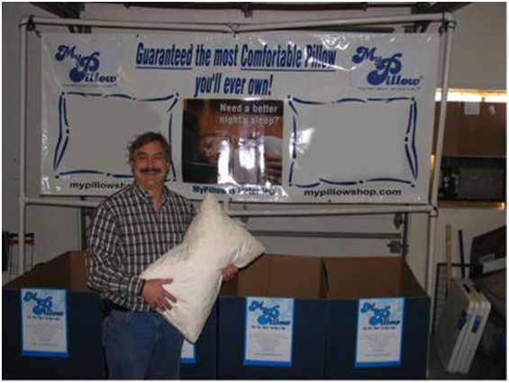 Mike standing in front of MyPillow booth