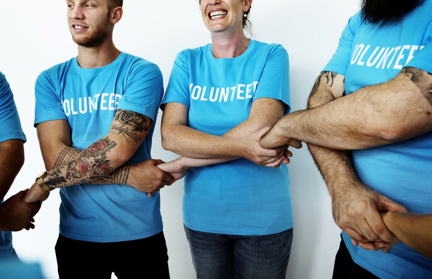 group of people in volunteer shirts