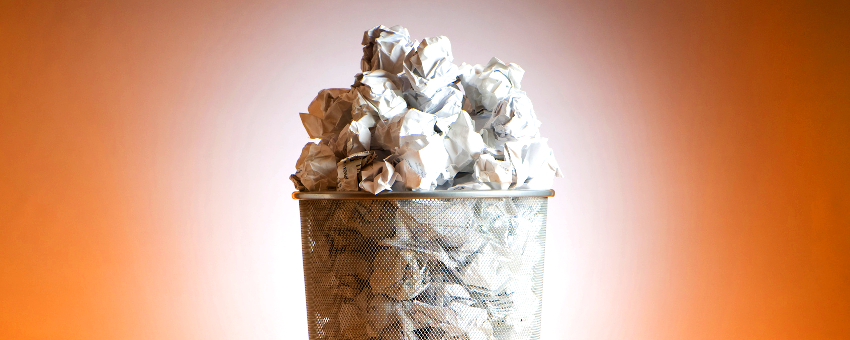 Crumpled paper in trash can