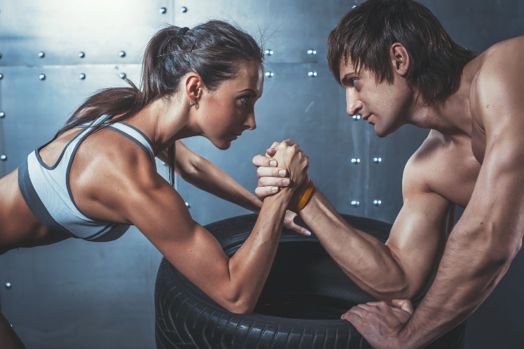 two fitness models arm wrestling