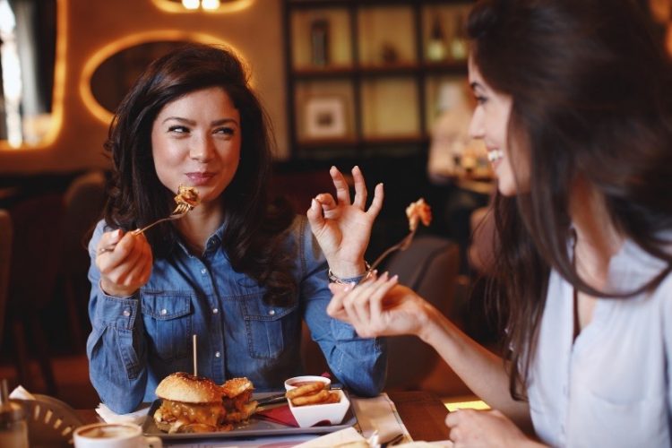 two women eating at a restaurant