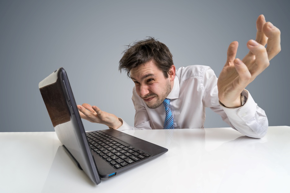 frustrated man looking at his computer