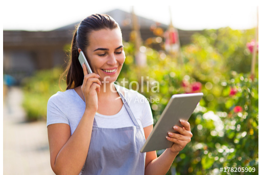 garden center worker using tablet
