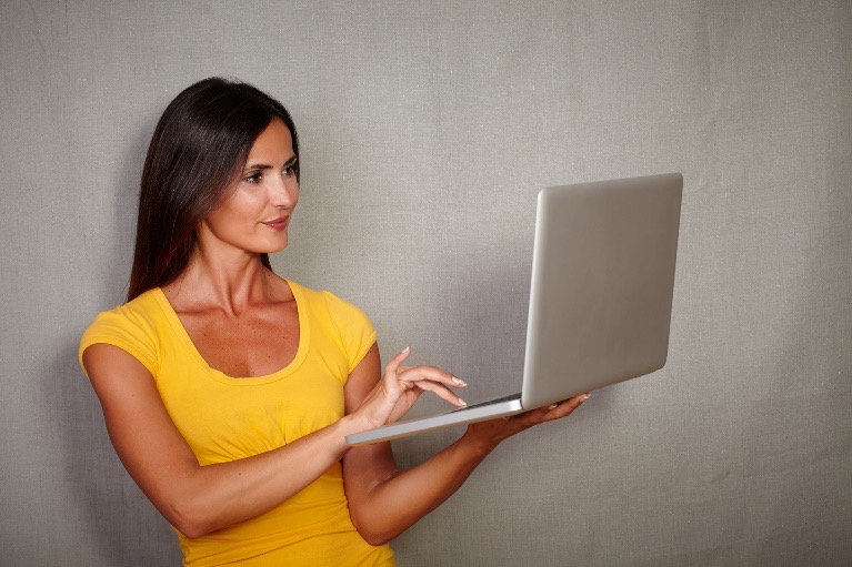 woman looking at laptop