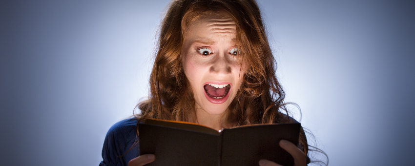 Woman reading horror story