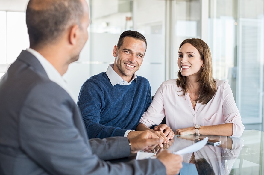 couple in a meeting with a mortgage broker