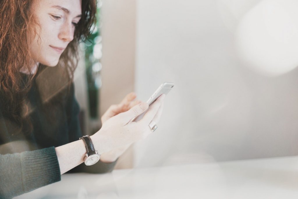 woman on her smart phone