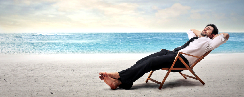 Businessman relaxing on beach
