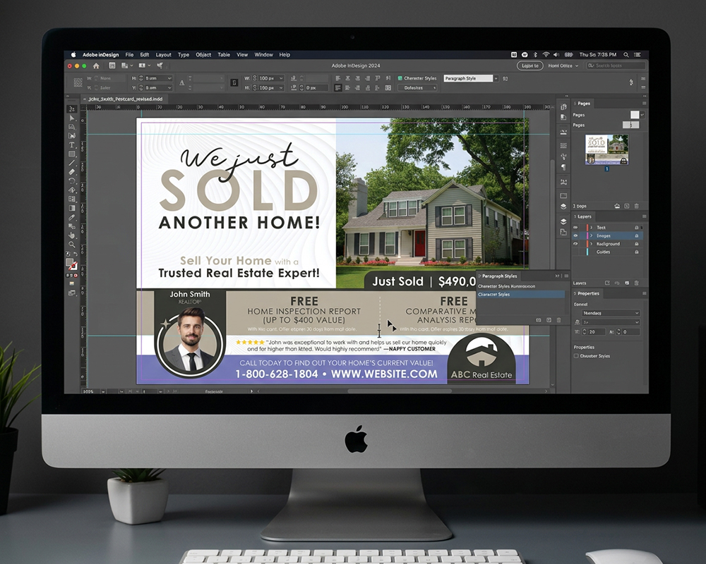 Graphic designer editing a Just Sold postcard design in Adobe InDesign