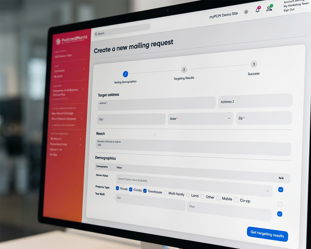 myPostcardMania portal on a monitor showing a new mailing request form with a target address field