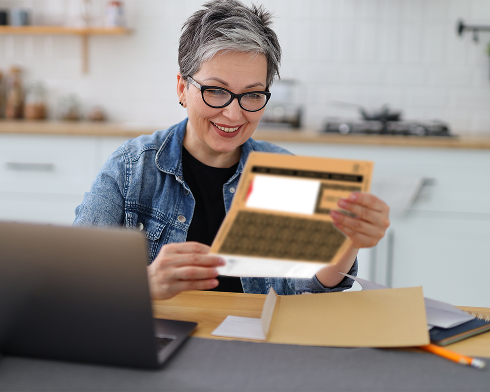 Woman holding a snap apart mailer